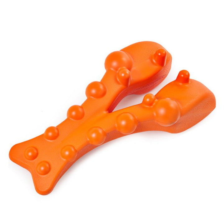 Orange dog chew toy with textured surface on a white background