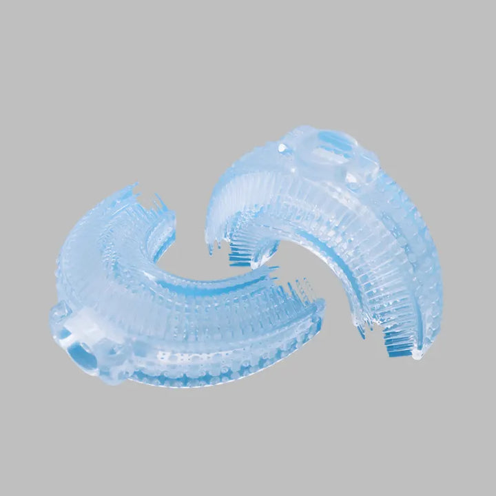 Clear silicone U-shaped replacement brush head for RelaxRiser™ kids electric toothbrush, suitable for ages 2–6, shown on a light gray background.