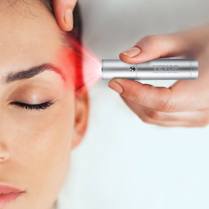 Close-up of a woman receiving red light therapy near her eye area using the RelaxRiser™ DualGlow Red Light Wand, highlighting its use for facial rejuvenation and skin health.